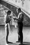 (L-R): Dancer Barbara Milberg speaking with choreographer Jerome Robbins about her costume.