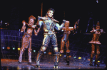 Robert Torti (C) and other dancer-actors, costumed as trains during a scene from the play "Starlight Express."