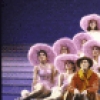 Actor Keith Carradine (C) with cast in a scene from the Broadway musical "The Will Rogers Follies." (New York)