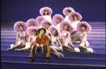 Actor Keith Carradine (C) with cast in a scene from the Broadway musical "The Will Rogers Follies." (New York)