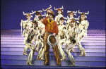 Actor Keith Carradine (C) with cast in a scene from the Broadway musical "The Will Rogers Follies." (New York)