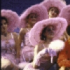 Actor Keith Carradine (C) with cast in a scene from the Broadway musical "The Will Rogers Follies." (New York)