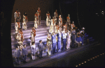 Actors Marla Maples and Mac Davis (C) with cast in a scene from the first replacement cast of the Broadway musical "The Will Rogers Follies." (New York)