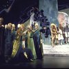 Actors (4R-R) Ted Ross, Stephanie Mills, Tiger Haynes & Stu Gilliam (who was replaced prior to Broadway opening) w. cast in a scene fr. the Broadway musical "The Wiz." (New York)