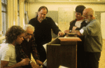 (L-R) Musical director Scott Frankel, composer Leonard Bernstein, Musical Supervisor Paul Gemignani, actor Scott Wise & director/choreographer Jerome Robbins around piano during rehearsal for the Broadway musical retrospective "Jerome Robbins' Broadway." (New York)