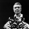 British actor Michael Redgrave holding a crown in a scene from the stage play "The Hollow Crown"