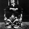 British actor Michael Redgrave holding a crown in a scene from the stage play "The Hollow Crown"