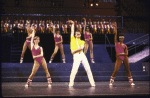 Actor Don Correia (C) w. cast in a scene fr. the  Radio City Music Hall revue "5-6-7-8- Dance!." (New York)