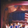 Actors (C Top-Bottom) Ann Miller and Mickey Rooney with cast in the patriotic finale of the Broadway musical burlesque revue "Sugar Babies." (New York)