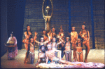 Actors (Front) Eartha Kitt & Ira Hawkins w. cast in a scene fr. the Broadway musical "Timbuktu!." (New York)