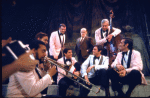 Actors (L-R) John Gordon, Vaughn DeForest, Adam Smith, Warren Meyers, Robert Weil, Cliff Gorman (as comedian Lenny Bruce), Ernie Furtado and Ron Odrich in a scene from the Broadway play "Lenny." (New York)
