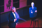 Actor Jack Gilford (L) performing at 100th birthday tribute to legendary Broadway director George Abbott (represented in cardboard cutout at R), "Happy Birthday, Mr. Abbott!." (New York)