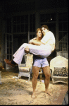 Actor Jeff Daniels carrying Christopher Reeve in a scene fr. the Broadway play "Fifth of July." (New York)