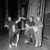 New York City Ballet - Labanotation director Ann Hutchinson (R) shows system to dancers Judith Green and Nicholas Magallanes with Michael Lland (2R) assisting (New York)