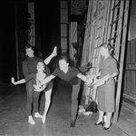New York City Ballet - Labanotation director Ann Hutchinson (R) shows system to dancers Judith Green and Nicholas Magallanes with Michael Lland (2R) assisting (New York)