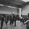 New York City Ballet rehearsal of "La Valse" with choreographer George Balanchine assisting with Patricia McBride in lift (New York)