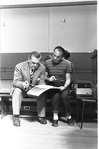 New York City Ballet rehearsal of "Agon" with George and pianist Nicholas Kopeikine looking at score, choreography by George Balanchine (New York)