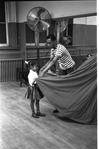 New York City Ballet rehearsal of "A Midsummer Night's Dream" with Arthur Mitchell and child, choreography by George Balanchine (New York)