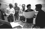 New York City Ballet rehearsal room, Jerome Robbins, Edward Bigelow, George Balanchine and costumer Barbara Karinska looking at Nicholas Benois' sketches for "Theme and variations", choreography by George Balanchine (New York)