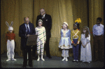 Mayor Koch presents an award to Lincoln Kirstein, with children from the School of American Ballet in costume for "The Nutcracker", (New York)