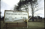 New York City Ballet dancer Violette Verdy poses with sign announcing the new Saratoga Performing Arts Center (Saratoga)