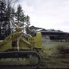 New York City Ballet dancer Violette Verdy poses on a tractor amidst the construction of the new Saratoga Performing Arts Center (Saratoga)
