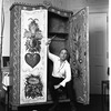 New York City Ballet Master George Balanchine with cabinet he designed and painted himself (New York)