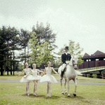 New York City Ballet - Susan Hendl, Violette Verdy and Lynn Stetson pose with horse and rider (garbed for dressage) for publicity opening of Saratoga Performing Arts Center (Saratoga)