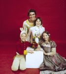 Studio portrait of Jacques d'Amboise and son Christopher, twin daughters Catherine and Charlotte all in costume for a New York City Ballet production of "The Nutcracker." (New York)
