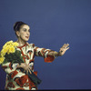 Martha Graham poses with flowers