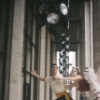 New York City Ballet - Publicity photo Patricia McBride and Edward Villella on the balcony of the unfinished New York State Theater at Lincoln Center, in "Tarantella" costume, choreography by George Balanchine (New York)