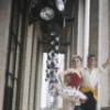 New York City Ballet - Publicity photo Patricia McBride and Edward Villella on the balcony of the unfinished New York State Theater at Lincoln Center, in "Tarantella" costume, choreography by George Balanchine (New York)