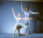 New York City  Ballet  - Publicity photo Patricia Wilde and Andre Prokovsky in "Raymonda" posing in front of fountain in plaza at Lincoln Center, choreography by George Balanchine (New York)