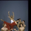 (Seated, L to R) Mark Dendy, Nathan Montoya, Donald Troise, (center, in red) Susan Kikuchi, and others in a studio portrait of the Martha Graham Student Company's production of Graham's "Diversion of Angels"