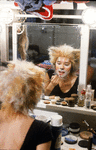 Actress Christine Langer applying make up before going onstage in musical "Cats"