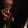 Musician Larry Adler with harmonica. (New York)