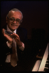 Musician Larry Adler with harmonica. (New York)