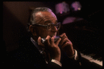 Musician Larry Adler playing the harmonica. (New York)