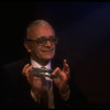 Musician Larry Adler playing the harmonica. (New York)