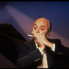 Musician Larry Adler playing the harmonica. (New York)