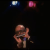 Musician Larry Adler playing the harmonica. (New York)