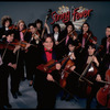 Studio publicity photograph of conductor Marin Alsop (C) with musical group "String Fever" (New York)