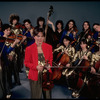 Studio publicity photograph of conductor Marin Alsop (C) with musical group "String Fever" (New York)