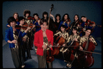 Studio publicity photograph of conductor Marin Alsop (C) with musical group "String Fever" (New York)