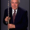 Publicity shot of musician Julian Baker holding flute (New York)