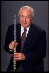 Publicity shot of musician Julian Baker holding flute (New York)