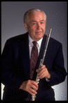 Publicity shot of musician Julian Baker holding flute (New York)