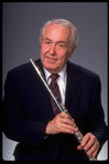 Publicity shot of musician Julian Baker holding flute (New York)