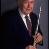 Publicity shot of musician Julian Baker holding flute (New York)