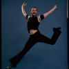 Publicity shot of director/choreographer Michael Bennett dancing in studio (New York)